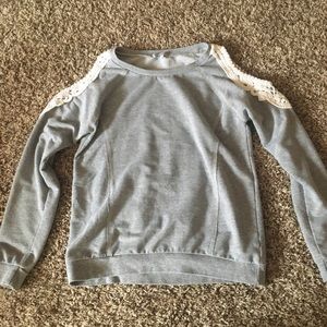 Gray sweater, lace shoulders cut out.